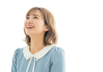 Joyful young asian woman looking up with a bright happy smile