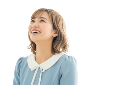 Joyful young asian woman looking up with a bright happy smile