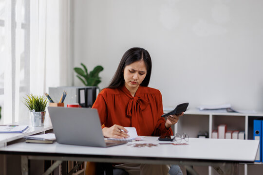 Credit card problem. Worried and stress young woman sitting in living room working and get headache make purchase in online store on laptop

