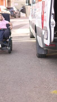 Person with a physical disability using a van ramp