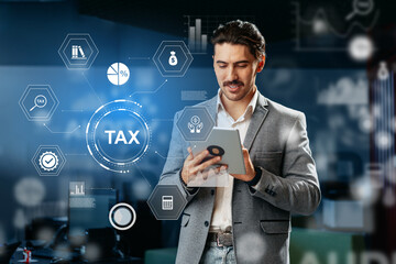 Professional man analyzing tax data with a digital tablet in an office setting