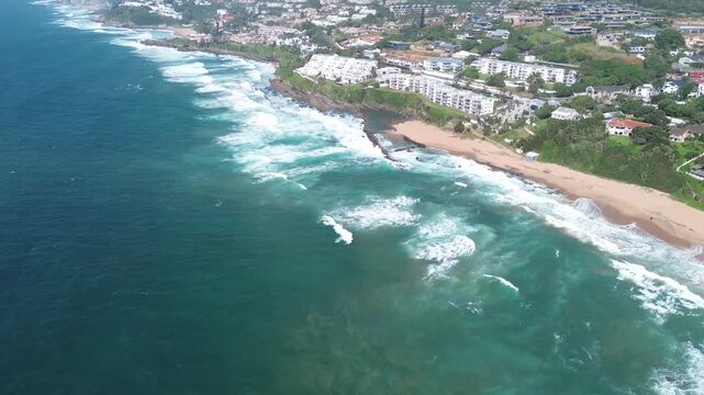 Ballito Coastal tourist town camera moving away from beautiful beach and town on the North Coast, KwaZulu-Natal, South Africa Aerial 4K Video