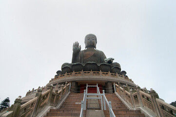 Low angle view of big bronze Buddha Statue in Lantau Island, Hong Kong.