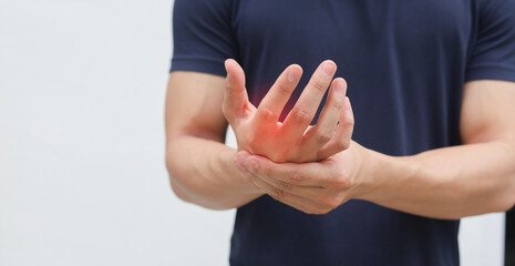 close up employee man massage on his hand and arm for relief pain from hard working ,carpal tunnel syndrome concept