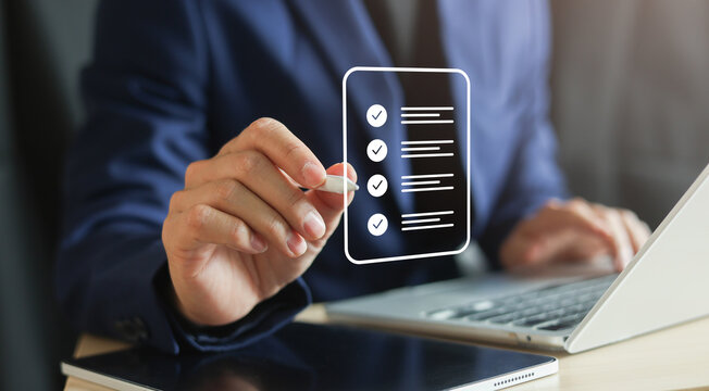 close up businessman hand check online questionnaire survey from website to rate score and share aspect of audience after complete from seminar for business corporation concept