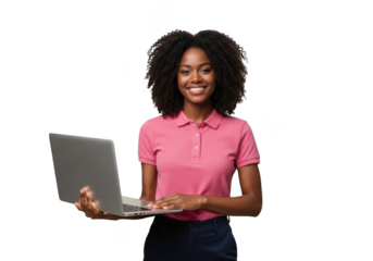 Smiling young african american woman in a pink polo shirt holding and typing on a silver laptop isolated on transparent background