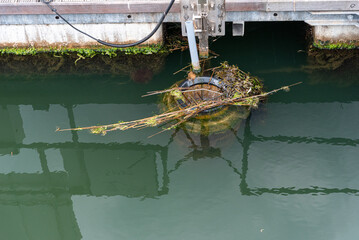 Harbor Marina trash traps in the water that captures the floating waste