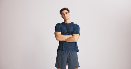 Portrait, fitness and man with arms crossed in studio for strength, exercise pride and healthy...