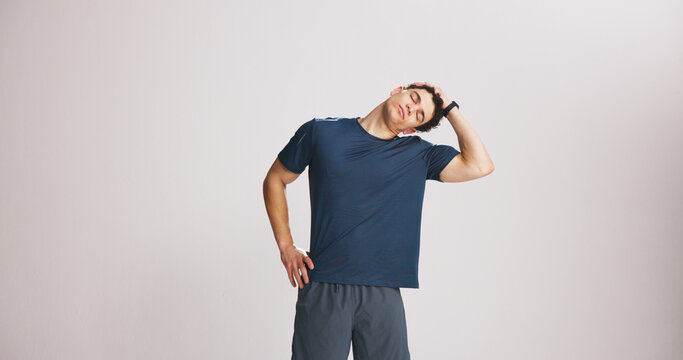 Fitness, neck and stretching with man on studio space for start of training or workout routine. Exercise, limber and warm up with athlete on white background mockup for challenge or preparation