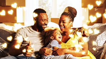 Cheerful family celebrates new home with joy and laughter. Boxes in background hint at move