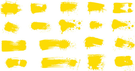 Collection of Yellow Paint Splatters and Brush Strokes on White Background