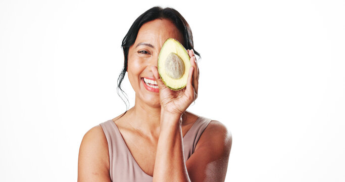 Portrait, skincare and mature woman with avocado, mockup space or facial treatment with antioxidants. White background, cosmetics and fruit with anti aging benefits for person, studio and dermatology