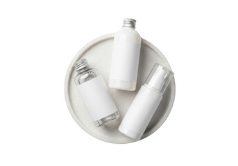 Assorted blank cosmetic bottles on round tray mockup for beauty product display. isolated on transparent background