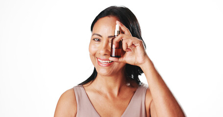 Woman, skincare serum and bottle in studio portrait with smile, pride and mockup space on white background. Mature person, beauty and dermatology with essential oil, liquid and anti aging in Colombia