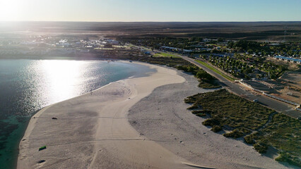 Aerial view of Coral Bay and beach in Western Australia with turquoise ocean and white sand