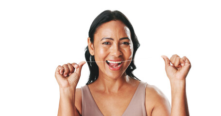 Fototapeta premium Mature, happy woman and portrait with dental floss for cleaning teeth on a white studio background. Female person, model or smile with thread or string for hygiene, fresh breath or oral and gum care