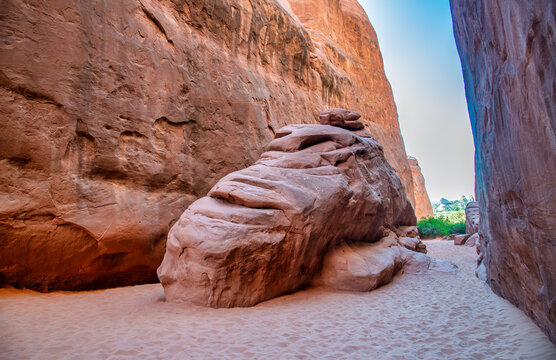 Red rock canyon walls creating dramatic landscapes inside Arches National Park desert