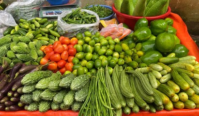 Bangladesh Street Vendor Selling Fresh Vegetables from a Cart on a Busy Market Road