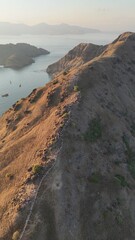 Fototapeta premium Scenic aerial panorama of Komodo National Park with islands surrounded by blue ocean
