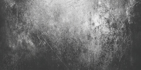 Grunge textured background in black and white with scratched and distressed cement wall effect.