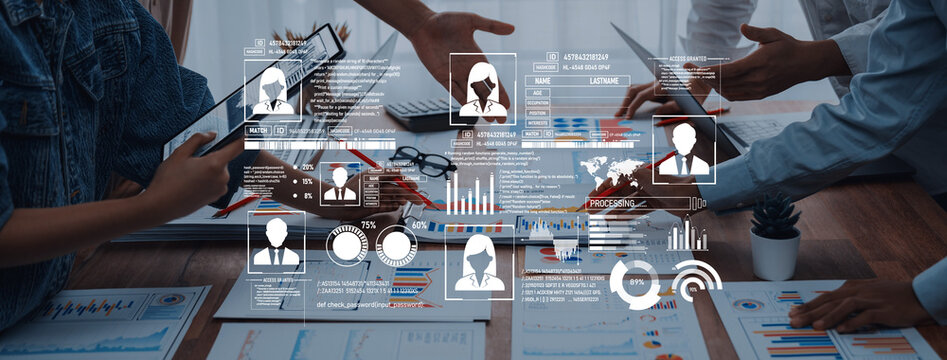 A dynamic team engages in data analysis with digital devices, exchanging ideas and insights in a modern workspace. Focus on innovation and collaboration. Trope