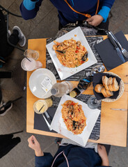Gourmet pasta meal being eaten at restaurant with authentic Italian flavors and presentation
