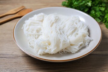 Thai rice noodle in white ceramic plate,thai called Khanom Jeen	
