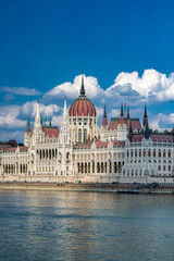 Fototapeta premium Hungarian Parliament Building on Danube River in Budapest. Beautiful view of Budapest Parliament with reflection in water. Iconic Hungarian landmark. Budapest cityscape with Parliament.