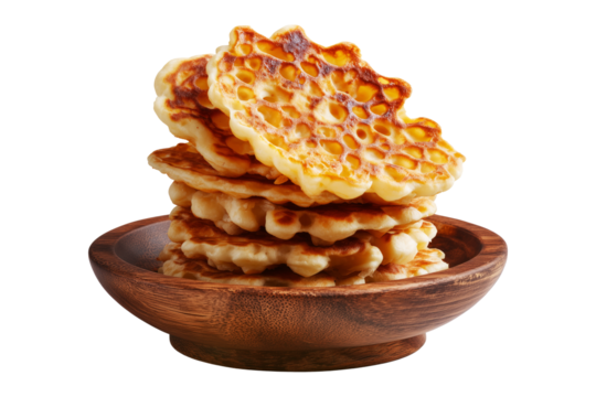 Sago Pancakes thin crepes or stack of pancakes topped with powdered sugar on wooden plate, isolated on white transparent background, Papua New Guinea breakfast