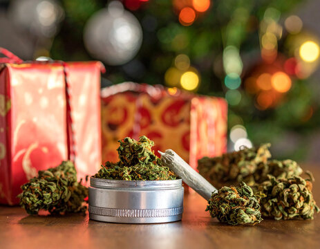 Christmas cannabis: festive gifts and holiday marijuana on a wooden table - Powered by Adobe