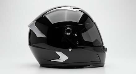 Black motorcycle helmet with silver accents on a white background, side view.