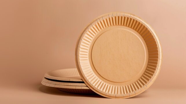 A stack of eco-friendly, biodegradable paper plates in a neutral color against a soft, muted background. Ideal for sustainable dining and events.