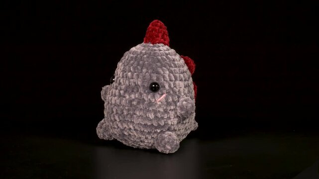 Close-up footage of animal figures knitted with threads.