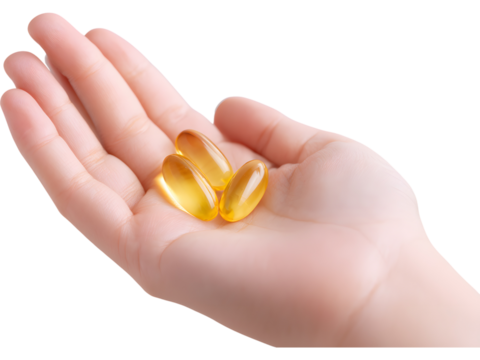 Female hand holding omega capsules isolated on transparent background, perfect for health and wellness visuals..