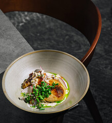 Delicious grilled chicken served in a contemporary bowl at a stylish restaurant