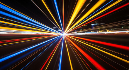 Colorful light trails create an abstract pattern of motion and speed