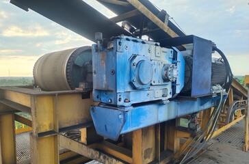 Coal conveyor machine transporting material to the stockpile, symbolizing mining operations, energy production, and industrial process. Perfect for illustrating coal industry, factory systems