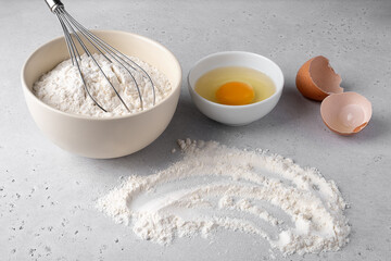 Baking Preparation with Flour, Egg, and Whisk