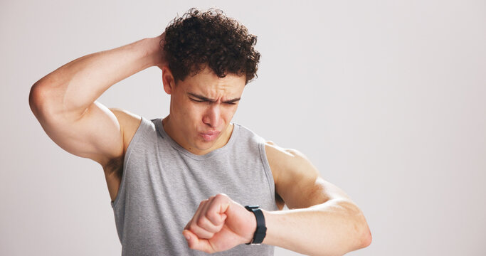 Fitness, tracking and watch with confused man on studio space for training or workout fail. Exercise, negative result and time with athlete on white background mockup for performance feedback