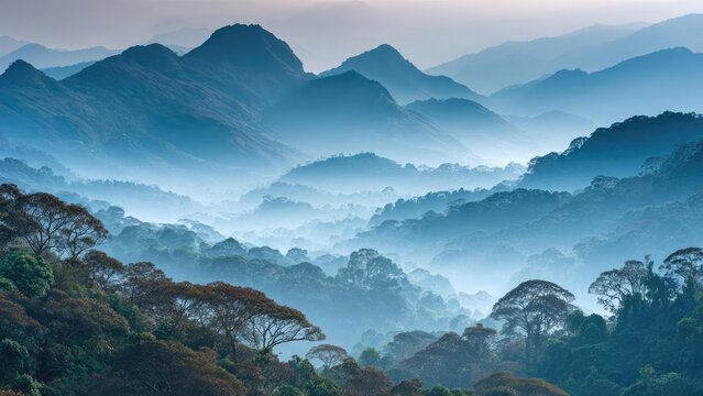 Layered blue mountains fade into the distance, with a misty forest in the foreground and soft fog filling the valleys. Concept Layered Blue Mountains, Misty Forest Foreground, Soft Fog in Valleys - Powered by Adobe
