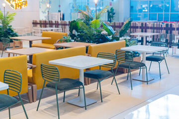 Tables and chairs in the restaurant room