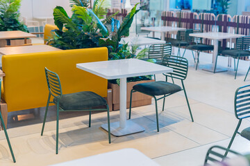 Tables and chairs in the restaurant room