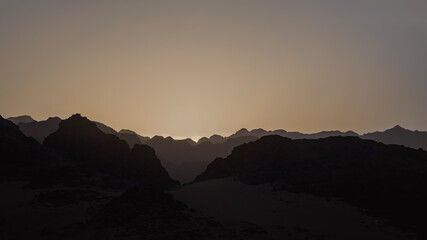 rocky mountains and desert landscape and sunset sky in Egypt