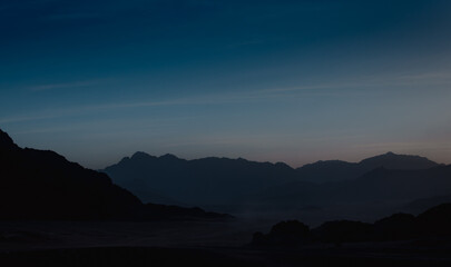 landscape rocky mountains and desert and sky at dawn in Egypt