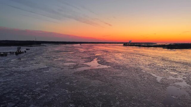 Aerial Flight on the Frozen Delaware River at Sunset