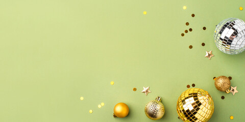 Festive Christmas gold ornaments on a green background.