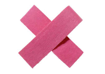 Pink adhesive bandages cross on stark black background