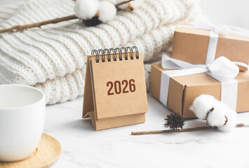 Minimal winter composition with 2026 calendar and gift boxes