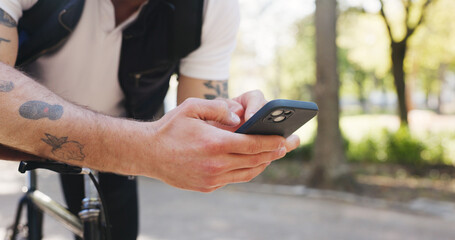 Hands, phone and texting with bicycle at park with digital map, search and contact with scroll in nature. Person, smartphone and rest on bike with mobile app, click or location for travel in summer