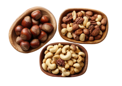 Wooden bowls brimming with hazelnuts and mixed nuts
